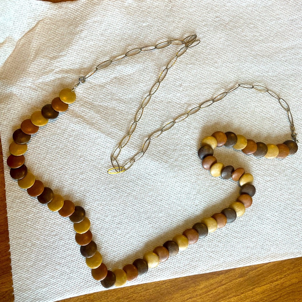 Wooden bead and gold colored chain necklaces